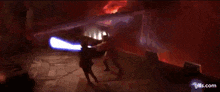 a person is holding a gun in front of a fire .