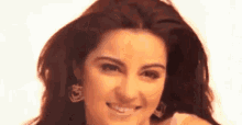 a close up of a woman 's face with a white background .