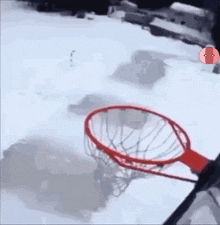 a basketball hoop in the snow with the letter r visible