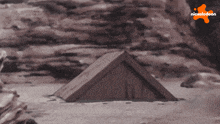 a drawing of a triangle with a nickelodeon logo above it