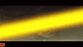a yellow beam of light is coming out of a cartoon character