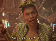 a man says i 'm living for the drama in a striped jacket