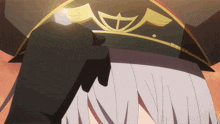 a close up of a person 's head with a hat on