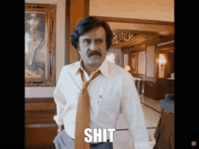 a man with a mustache is wearing a white shirt and tie and the word shit is above him