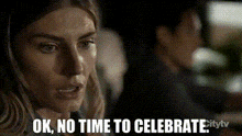 a woman says ok no time to celebrate in a pixelated image .