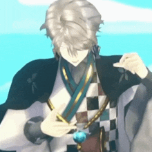 a man is wearing a necklace with a blue ball on it