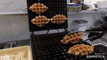 a waffle maker is being used to make waffles and the words made in animotica are on the bottom of the image