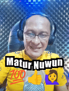 a man wearing headphones and a yellow shirt with the number 700 on it
