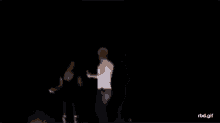 a blurry picture of a man dancing on a stage .