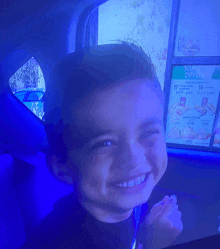 a little boy is smiling in front of a menu that says so different