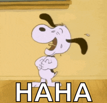 a cartoon of snoopy laughing with the word haha behind him