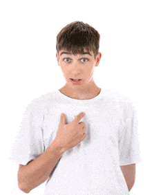 a young man in a white t-shirt is pointing at his chest