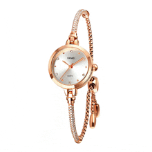 a skmei quartz watch with a bracelet around the wrist