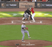 a baseball game is being played in front of a sign that says betmgm
