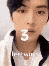 a close up of a person 's face with the number 3 on it