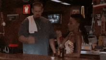 a man in a bar says lord jesus in front of a bottle