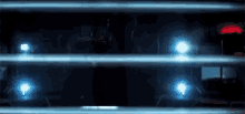 a close up of a car 's headlights behind a metal fence at night .