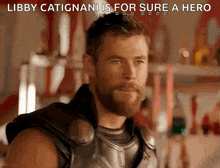 a close up of a man with a beard and the words libby catignani is for sure a hero