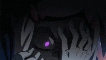 a person covering their face with their hands and a purple eye