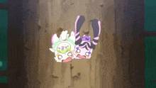 two cartoon characters are laying on a wooden surface