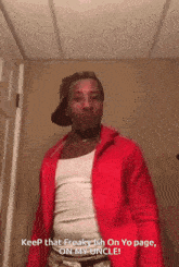 a man wearing a red jacket and a white tank top says keep that freaky ish on yo page on my uncle