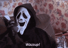 scream is talking on a cell phone while wearing a hooded jacket .