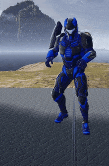 a blue and black armored soldier is standing on a tiled floor
