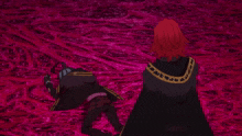 a person with red hair and a black cape with a gold stripe on the sleeve