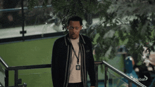 a man wearing a lanyard with a badge that says ' global ' on it
