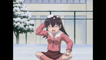 a girl in a pink shirt is sitting in the snow