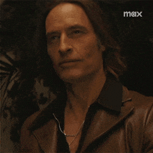a close up of a man 's face with the word max on the bottom