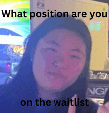 a woman with long hair is making a funny face and says what position are you on the waitlist