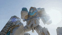 a giant robot is standing in front of a building with the sun shining on it