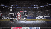 a hockey game is being played in a stadium with a score of 1 to 0