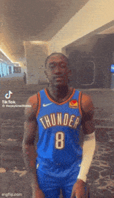 a man wearing a thunder jersey number 8