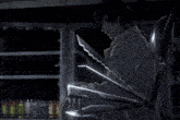 a man in a trench coat is holding a pair of scissors in his hand