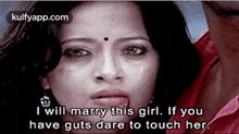 a woman is crying and talking to a man .