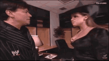 Stephanie Mc Mahon Eric Bischoff GIF - Stephanie Mc Mahon Eric Bischoff Kiss GIFs