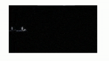a motorcycle is glowing in the dark with a white outline