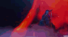 a close up of a woman singing into a microphone with a colorful background .