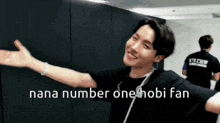 a man with his arms outstretched and the words nana number one hobi fan on the bottom