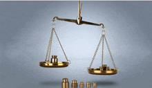 a pair of scales hanging from a ceiling with weights on them