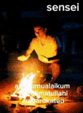 a man is sitting in front of a fire with the word sensei on the bottom