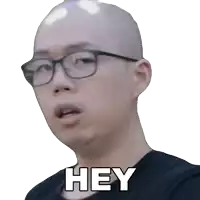 a bald man wearing glasses says hey on a white background