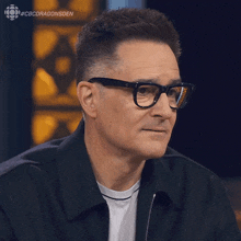 a man wearing glasses and a black jacket with the hashtag #cbcdragonsden on the bottom right