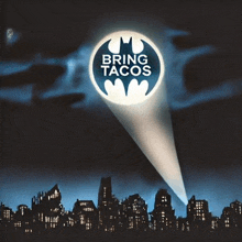 a batman logo that says bring tacos above a city skyline