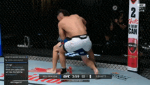 two men are wrestling in a cage with a sign that says 2 shots in every can on it