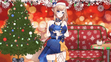 a girl wearing a santa hat is standing next to a christmas tree