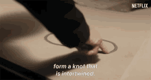 form a knot that is intertwined dark knot infinity twist