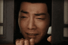 a man with his eyes closed and his mouth open